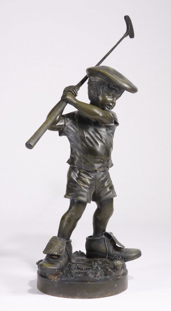 20th c. bronze figural sculpture: 20th century cast bronze sculpture of a young boy dressed in adult golf shoes and cap, with a putter in his hand, signed Jim Davidson, 40"h x 40.5"w x 19"d.