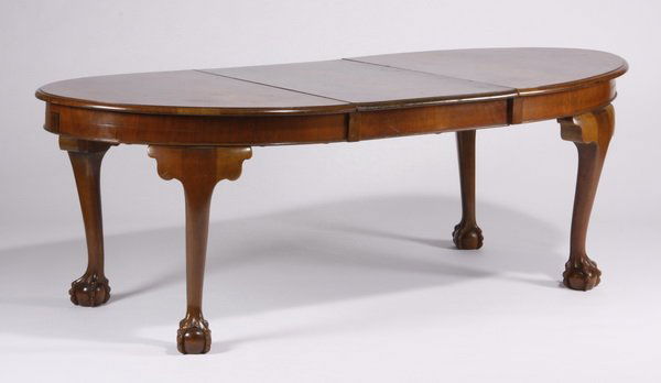 Italian burl wood dining table: Mid 20th century oval Italian burl wood dining table with one center leaf, all raised on cabriole legs terminating in ball and claw feet, 28.75"h x 84"l x 40.5"w with leaf, 60"l without the center lea