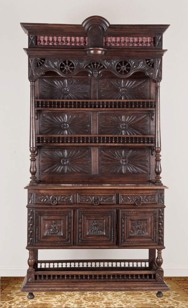 19th c. carved walnut Brittany buffet: Late 19th century carved walnut Brittany buffet, the upper cabinet with an inset rouge marble top and two plate racks with balustrade trim against a back displaying relief carved starburst pattterns, 