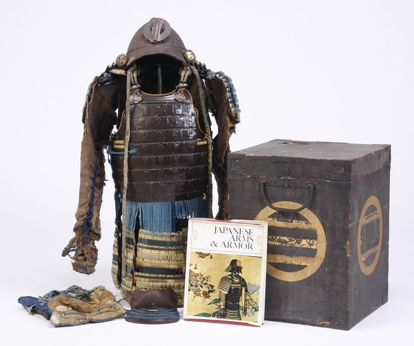 Japanese Edo period Samurai suit: Japanese Edo period Samurai suit of armor, helmet, and wooden storage box, the suit with lacquered steel breast and back plates, hinged on the wearer's left side and tied on the right, with kusazuri t