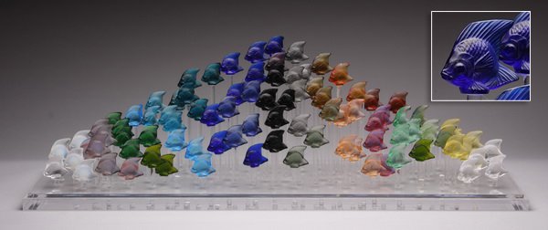 Lalique aquarium of 93 crystal fish: Late 20th century Lalique aquarium, comprised of 93 crystal fish in a variety of colors, mounted on plexiglass supports at graduating heights, each marked "Lalique / France", overall size 12.75"h x 39