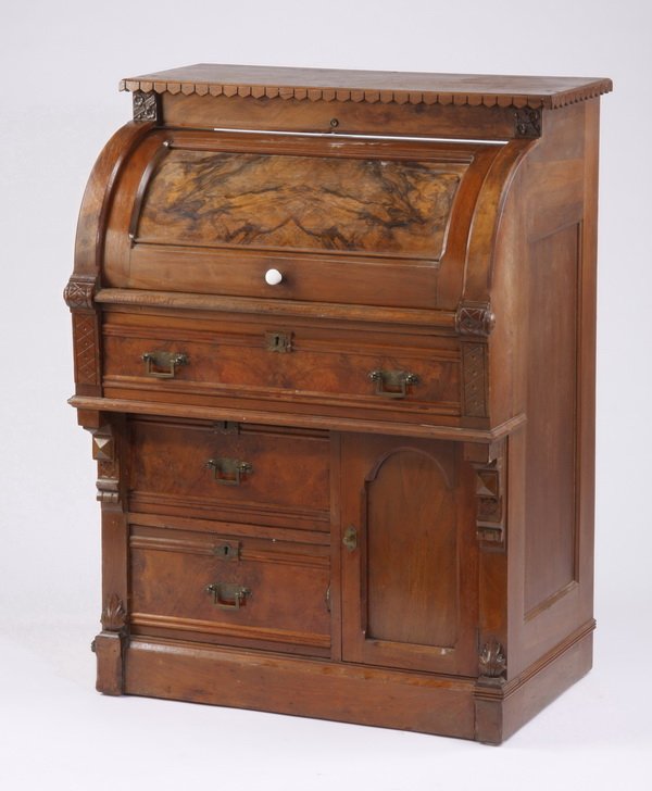 19th c. lady's secretary: Late 19th century lady's secretary, the cornice with repeating triangular trim and floral ornament along the sides, surmounting a roll top with central burl panel, opening to a drawer and compartments