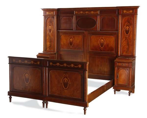 Mid 20th c. Italian marquetry inlaid bed: Mid 20th century Italian mahogany bed with attached marble top nightstands, the burl veneered panels marquetry inlaid with bow-topped cartouches encircling a putti holding a foliate wreath, all raised