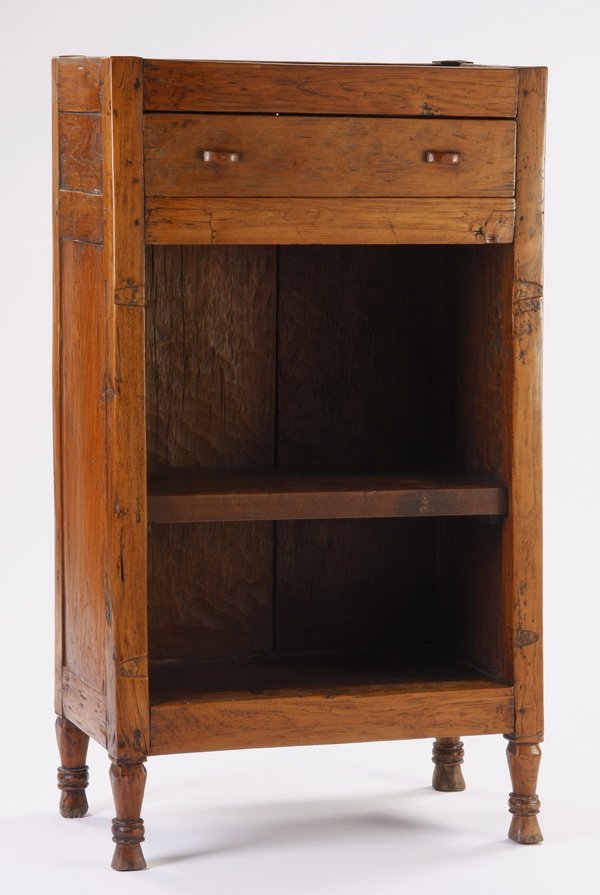 19th c. Primitive style hand-hewn cabinet: 19th century hand-hewn alder or birch wood cabinet crafted in the Primitive style, with a single drawer over an open cabinet with a central shelf, raised on inverted baluster form legs, 56"h x 32"w x 