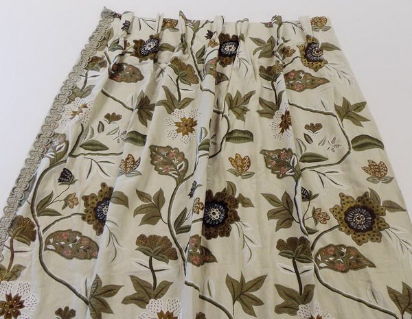 Pair of custom draperies w/ rods: Pair of custom designed and fabricated draperies (plus one addiitonal drapery panel), in a velvet and silk hand embroidered botanical pattern on an off-white linen ground, lined in a coordinating ligh