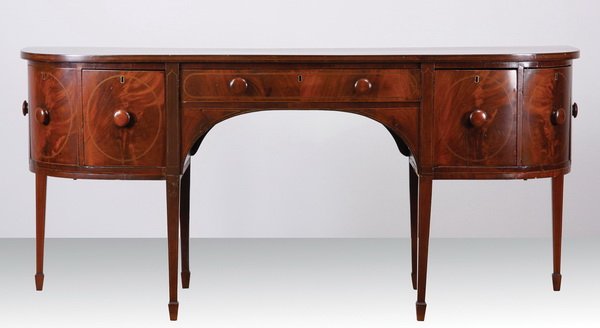 Late 18th c. Georgian style demilune buffet: Late 18th or early 19th century Georgian style inlaid mahogany demilune buffet with original wooden drawer pulls, the long central drawer flanked by deep drawers and cabinets, all raised on tapering s