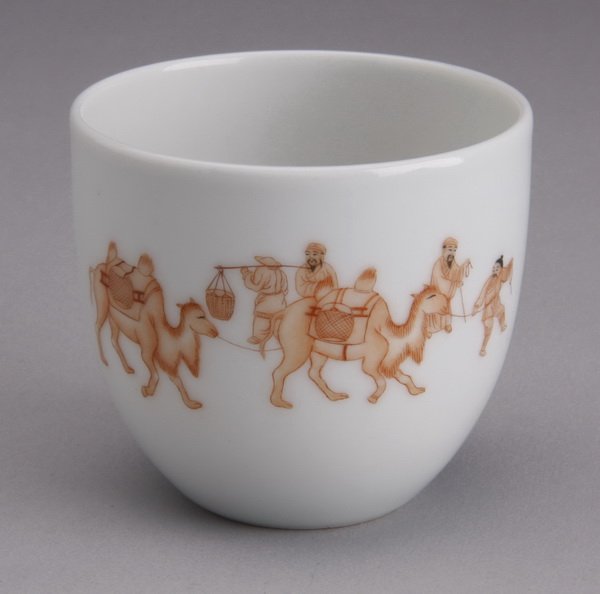 19th c. Chinese petite porcelain teacup: Late 19th c. Chinese petite porcelain teacup, the front with Mongolian figures leading camels, the back with Chinese writing, maker marked on the bottom, 2.25"h x 2.5" diameter.