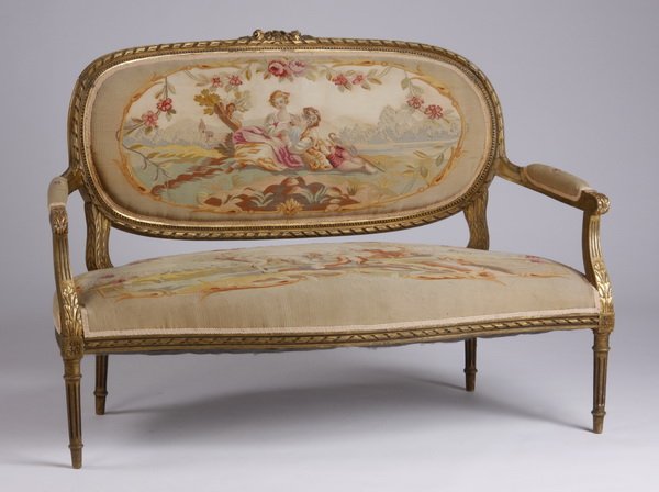 Mid 20th c. giltwood canape': Mid 20th century Louis XVI style giltwood canapé, with a carved rope-twist and acanthus frame, the back, arms, and seat upholstered in machine-woven Aubusson style tapestry, depicting pastoral scenes