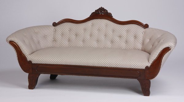 American Empire inspired mahogany settee: Mid 20th century American Empire inspired petite mahogany settee, the serpentine crest rail with a central carved grape cluster, the flared arms and shaped bracket feet with incised leaf designs, 31"h