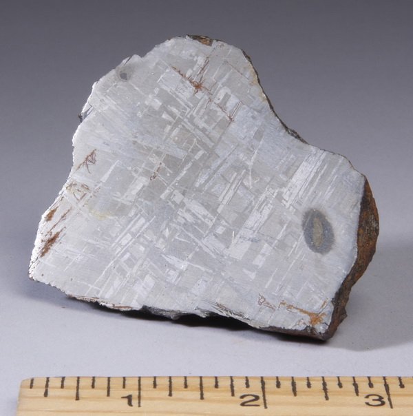 Meteorite found in Argentina: Meteorite, recovered in Campo del Cielo in Gran Chaco, Argentina, (the first recording of site excavation of meteorites in Chaco was by the Spanish in 1576), 2"h x 3.25"l x 3"w.