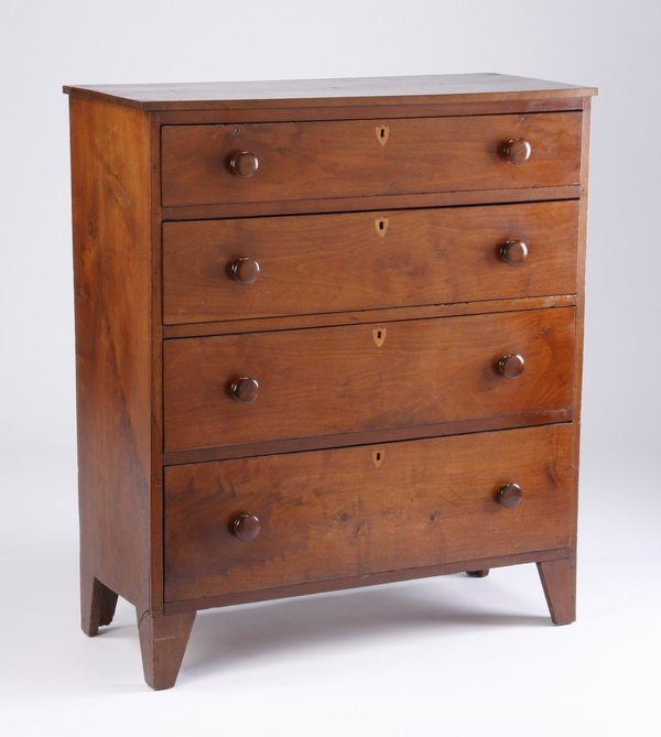 Early 20th c. mahogany chest of drawers: Late 19th or early 20th century mahogany four-drawer chest, with wood knobs and inlaid escutcheon plates, raised on angled bracket feet, 42"h x 37"w x 16.5"d.