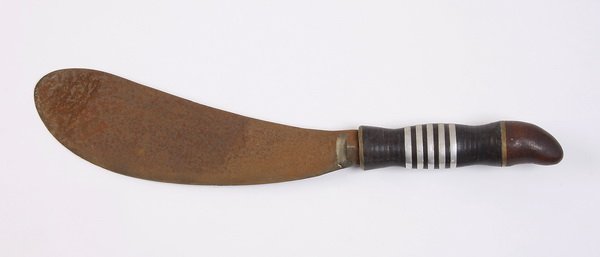 20th c. African machete: 20th century African machete, the wood handle inlaid with four parallel silver bands, 17"l x 4.5"w.