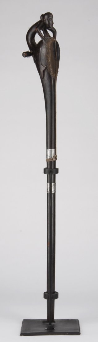 19th c. Sarangi musical instrument, Nepal: Late 19th or early 20th century Sarangi musical instrument, Terai, Nepal, in the form of a carved wood crouching figure surmounting a leather top drum and string, overall size including stand 48.5'h x