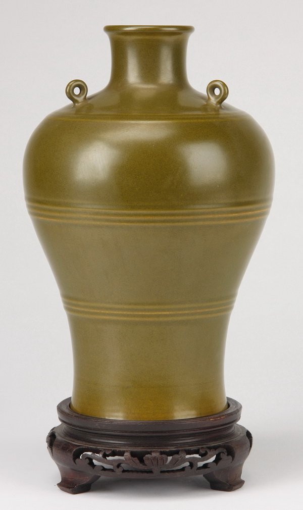 19th c. Chinese Qianlong porcelain vase: 19th century Chinese tea-dust porcelain vase, glazed in a mottled olive green, with three small loops atop, the underside bearing the Qianlong six-character impressed seal mark, 10.5"h x 6.5"w, with s