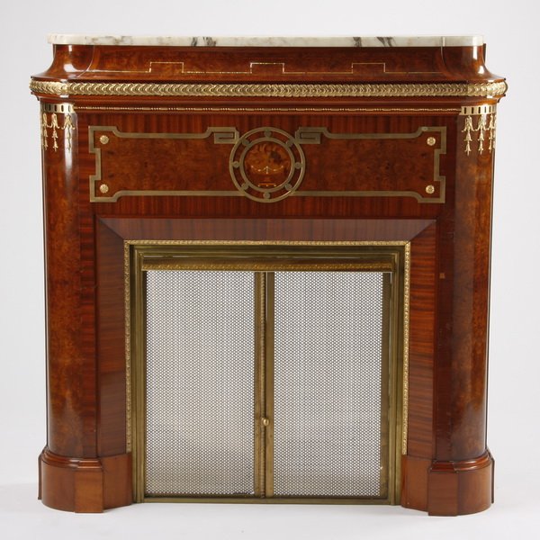Empire style marquetry inlaid mantel: Early 20th century American Empire inspired marquetry inlaid mahogany fireplace mantel surround with gilt bronze mounts and inset burl wood panels, the coved cornice with mother-of-pearl geometric det