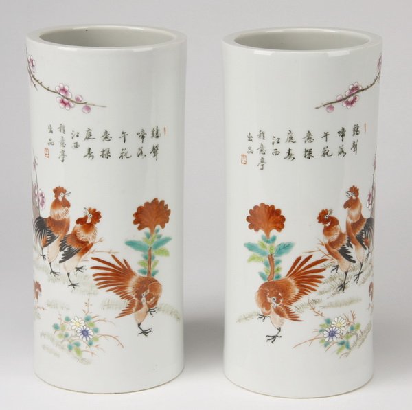 (2) Early Republic Period Chinese hat stands: Pair of early Chinese Republic period porcelain cylindrical hat stands, polychrome hand painted with mirror images of cockrels near a cherry blossom tree, and inscribed in the upper section, marked on