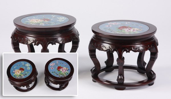(2) Carved Chinese stools with cloisonne' top: Pair of early 20th century carved Chinese stools with cloisonné tops depicting birds and cherry blossoms against a turquoise ground, all raised on a circular base, 14"h x 18"d x 15.5" diameter.