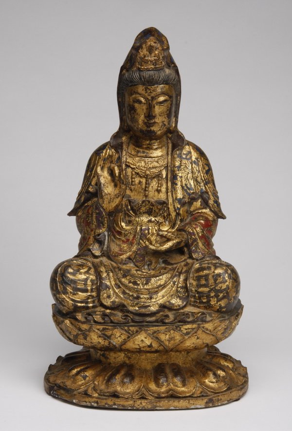 19th c. hand carved parcel gilt Buddha: Late 19th or early 20th century hand carved and parcel gilt Buddha with a polychrome patterned robe, seated in the meditative dhyanasana position on a pedestal form oval lotus base, 15.5"h x 9"w x 8"d