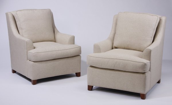 (2) Barbara Barry for Baker club chairs: Pair of Barbara Barry for Baker Furniture contemporary club chairs upholstered in a light beige herringbone fabric, with loose back and seat cushions, over square tapering feet, 38"h x 32"w x 39"d.