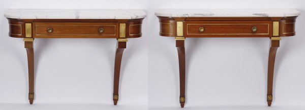 (2) Mid 20th c. marble top wall consoles: Pair of mid 20th century Argentinean parcel gilt mahogany wall mounted console tables, circa 1940s, made by Maison Jansen, the demilune white marble tops surmounting a central drawer, with curved ends