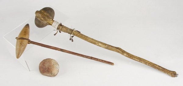 (2) Early Native American Indian weapons: Two early Native American Indian weapons, comprised of stone, wood, and leather, includes: (1) tomahawk 16"h x 6"w and (1) club with rounded stone, 24"h x 4"w. Provenance: De-accessioned by The Atlant