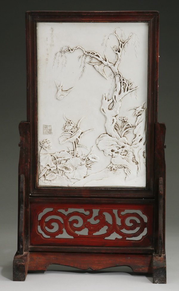 Early 20th c. Chinese porcelain table screen: Early 20th century Chinese moulded white porcelain table screen, depicting a pair of swallows in a landscape, inscribed upper left and with artist's seal lower left, 14.25"h x 9.5"w, overall size incl