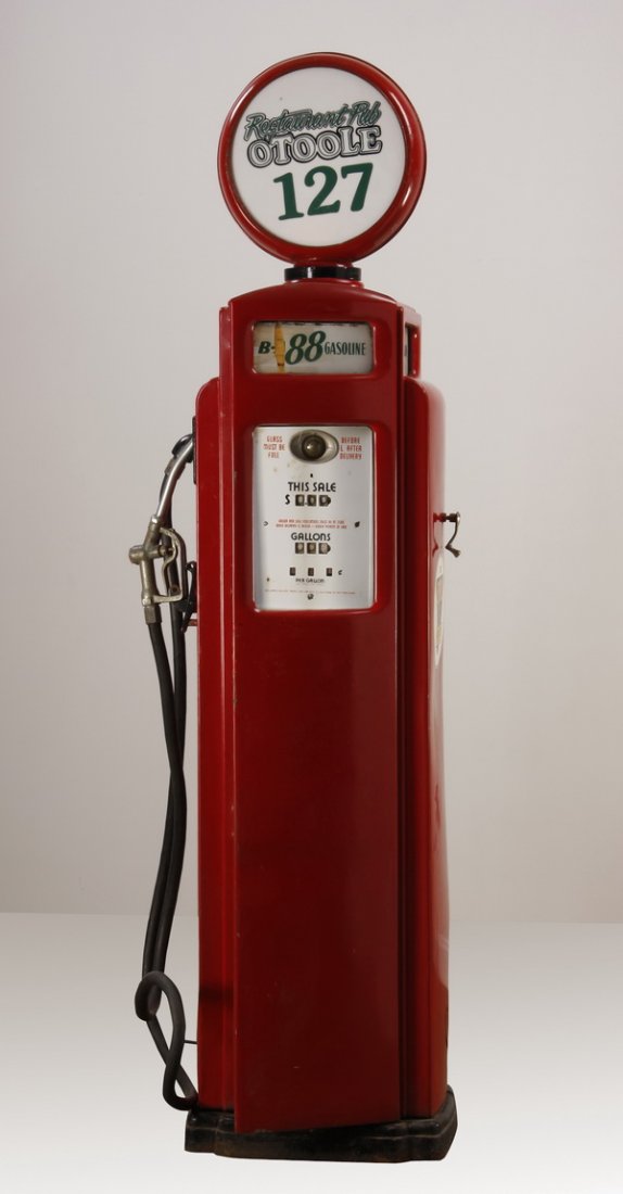 Early 20th c. American gas pump: Early 20th century American gas pump with streamlined moderne sides and base, the metal globe with replacement plexiglass signs marked Restaurant Pub O'Toole 127, 64"h x 27"w x 19"d.