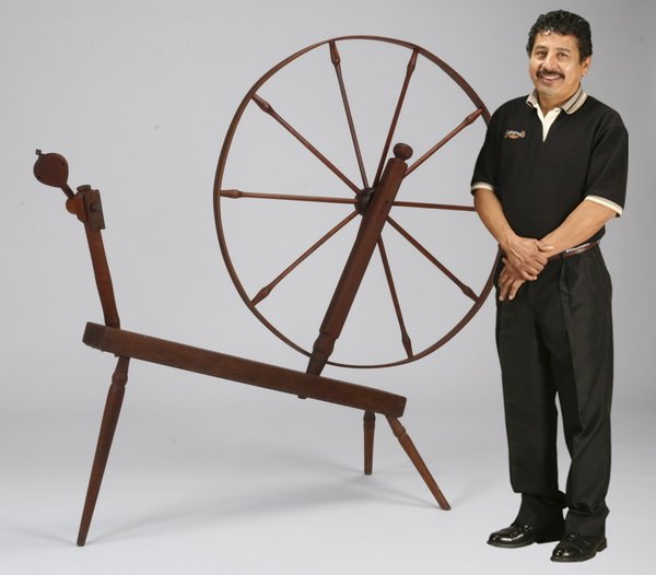 Oversized 19th c. spinning wheel and winder: Oversized mid 19th century wood spinning wheel 59.25"h x 66"l x 20"d, and weasel or yarn winder 45.5"h x 31"w x 22"d.