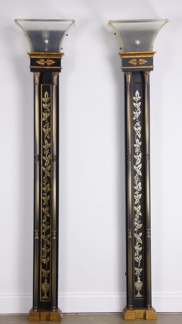 (6) 20th c. lighted pilasters: Set of six late 20th century ebonized and parcel gilt wood wall mounted light fixtures, formed as pilasters with a flaring resin shade surmounting a column adorned with a foliate vine, flanked by reed