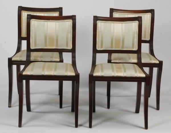 (4) Early 20th c. mahogany side chairs: Set of 4 mahogany open back side chairs, the straight back surmounting a square seat, each upholstered in light blue, white and light yellow striped fabric, raised on curved legs, 32.5"h x 19"w x 18.5