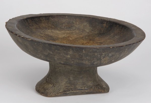 Toba Batak pedestal bowl, Indonesia: Toba Batak pedestal bowl, Samosir Island, Sumatra, Indonesia, the carved wood vessel raised on a circular base, 6"h x 12.5" diameter.