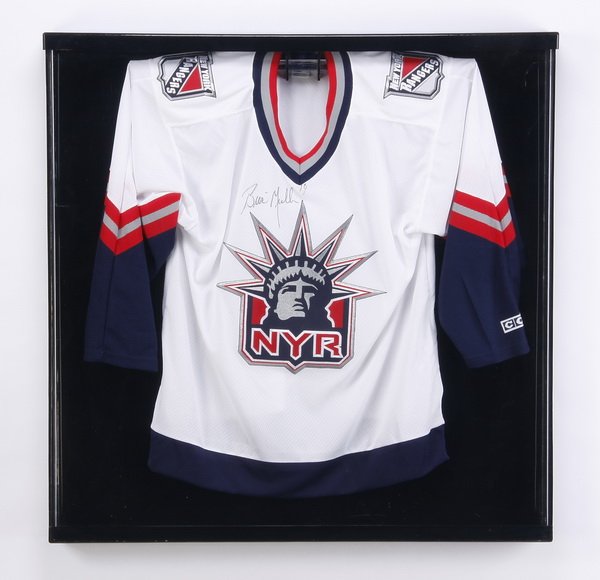 Brian Mullen autographed NY Rangers jersey: Framed and autographed Brian Mullen, New York Rangers ice hockey jersey, signed by the hometown hero "Brian Mullen, 19", mounted in a plexiglass display case, 35.5"h x 35.5"w x 3.5"d.