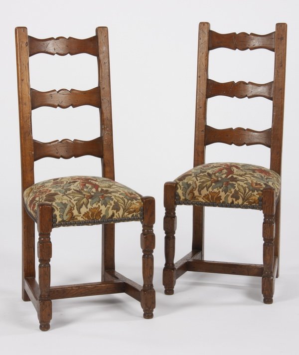 (2) French ladder back chairs: Pair of late 19th century French Provincial style walnut ladder-back side chairs, with floral upholstered seats, 43"h x 17.5"w x 18.5"d.