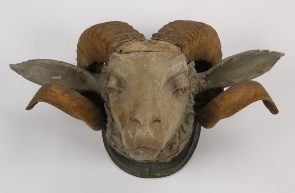 Carved wood ram's head with real horns: 20th century carved wood ram's head mount with taxidermied horns, 9"h x 16.5"w x 9.5"d.