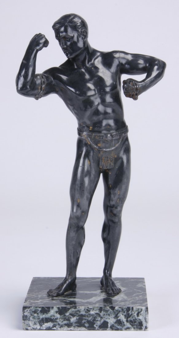 Mid 20th c. bronze sculpture: Mid 20th century bronze sculpture modeled as a standing male figure breaking chains, raised on a green marble square base, 10"h x 5"w x 4"d.