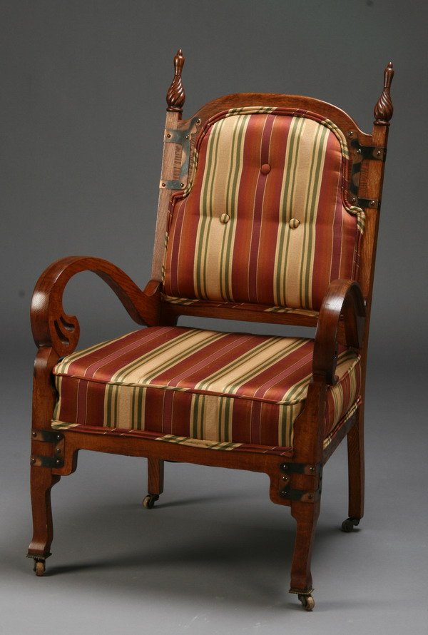 Early 20th c. Gothic Revival oak arm chair: Early 20th century American Gothic Revival oak arm chair with spiral twist finials and decorative copper bracing, 39"h x 24"w.
