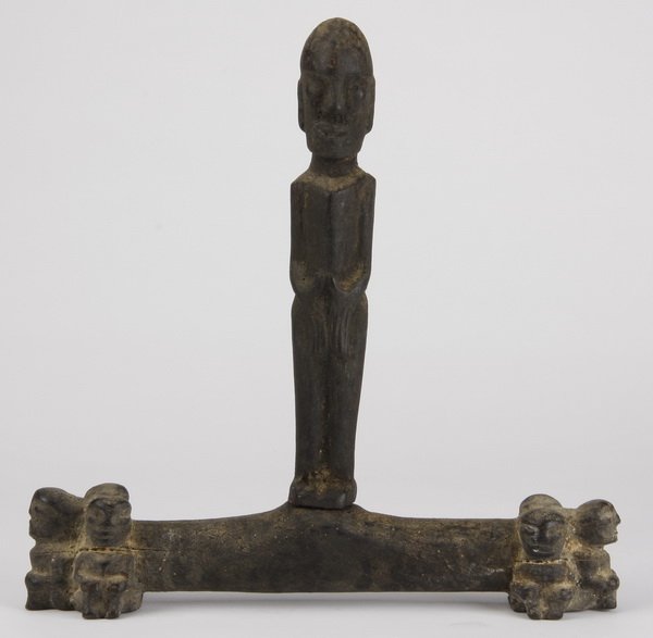 Apotropaic medicinal container: Apotropaic medicinal container, Batak, Sumatra, Indonesia, intended to hold "pupuk" to ward against black magic, of carved wood with the stopper formed as a male figure, surmounting a bone vessel with