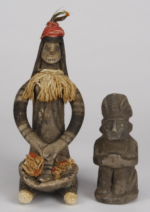 (2) Sumatra figures, Indonesia: Ancient Sumatra stone figure, Lake Toba, Batak, Indonesia most likely used as a fishing weight, 4.5"h x 2"w x 2"d; together with a painted and carved wood figure holding a food bowl, 8"h x 3.5"w x 4"d