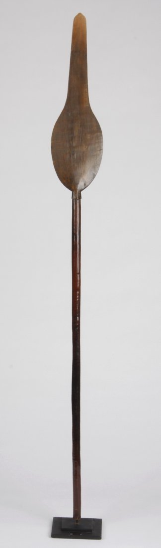 65"h West African ceremonial spear, pre 1950: West African ceremonial spear, pre 1950, carried in processionals to symbolize the tribe's strength, the carved wood form with a leaf-shaped blade, embellished with geometric details, ending in a long