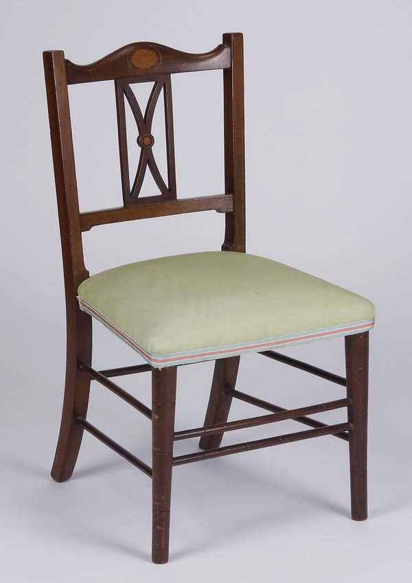 Early 20th c. English mahogany child's chair: Early 20th century Sheraton inspired mahogany child's chair, the backrest with an inlaid fan motif at the crest and pierce carved back splat, 28"h x 15.5"w x 15.5"d.