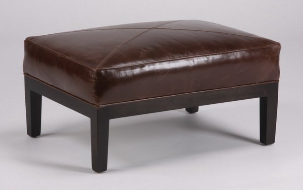 Contemporary brown leather ottoman: Contemporary style rectangular ottoman upholstered in chocolate brown leather, the hardwood frame with four slightly tapering square legs, 15"h x 28"w x 20"d.