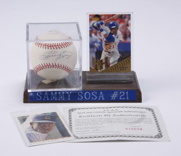 Sammy Sosa cards, autographed baseball: Chicago Cubs' home run great "Slammin' Sammy" Sosa baseball and card set, includes (1) autographed baseball, signed "#21 Sammy Sosa" and mounted in a plexiglass case and (1) baseball card mounted in a