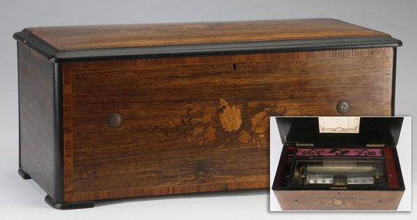 19th c. Swiss music box: Late 19th century Swiss music box, the case inlaid with floral marquerty and ebonized edges, opening to reveal the double comb mechanism, the interior lid with a paper label "8 Aires Discs Celestes", 