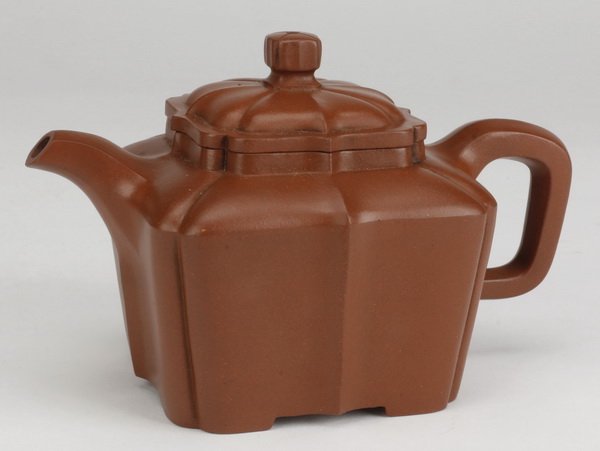 Early 20th c. Chinese Yixing Zisha teapot: Early 20th century Chinese Yixing stoneware teapot, the zisha clay modeled in a lobed form, with the lid and base marked, 3.5"j x 6"w x 4"d.