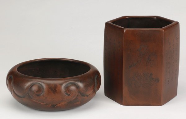 (2) Early 20th c. Chinese zisha clay vessels: Two late 19th or early 20th century Chinese zisha clay vessels, includes: (1) brush pot with incised sides alternating between landscapes and script, 6.5"h x 6"w, and (1) brush washer, the base with a