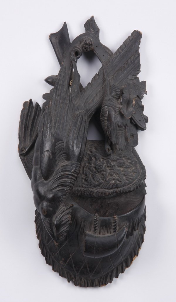Black Forest carved wall plaque: Late 19th or early 20th century Black Forest carved match-holder wall plaque formed as a game trophy over a hunter's bag, 12.25"h x 6"w x 2.75"d; together with a Black Forest decorative floral carving