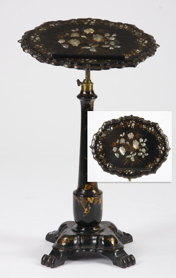 Victorian papier mache' music stand: Early 20th century Victorian papier mache' ebonized music stand, with hand painted gilt and floral designs inlaid with mother-of-pearl, features a telescoping serpentine oval top over a baluster form 