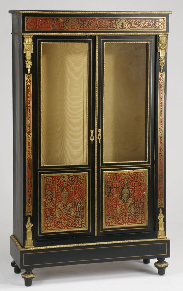 French ebonized and boulle inlaid vitrine: Late 19th century French Louis XV style vitrine, ebonized and boulle-inlaid with gilt-bronze mounts, adorned allover with scrolling floral designs, the double doors having glass panels over boulle pan