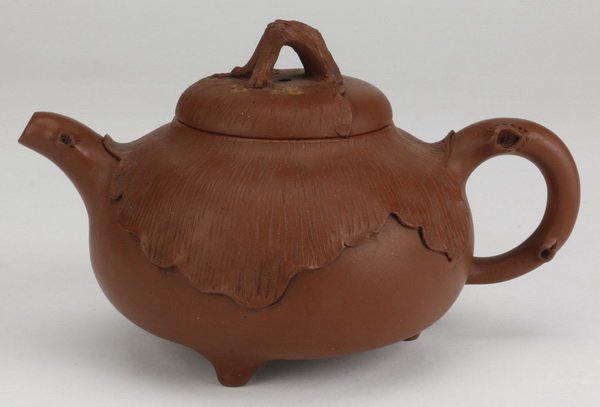 Early 20th c. Chinese Yixing Zisha teapot: Early 20th century Chinese Republic period Yixing stoneware teapot, the zisha clay modeled in a globular form, the top half with naturalistic decoration of a lily pad and handles formed as branches, 3