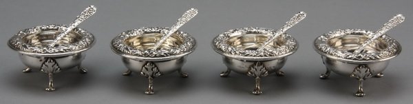 (6) Sterling silver salt cellars, marked: Set of six sterling silver salt cellars with corresponding spoons, includes: (4) S. Kirk & Son Inc., raised on three animal paw feet with acanthus decoration, a floral and foliate rim and a JLF monogr
